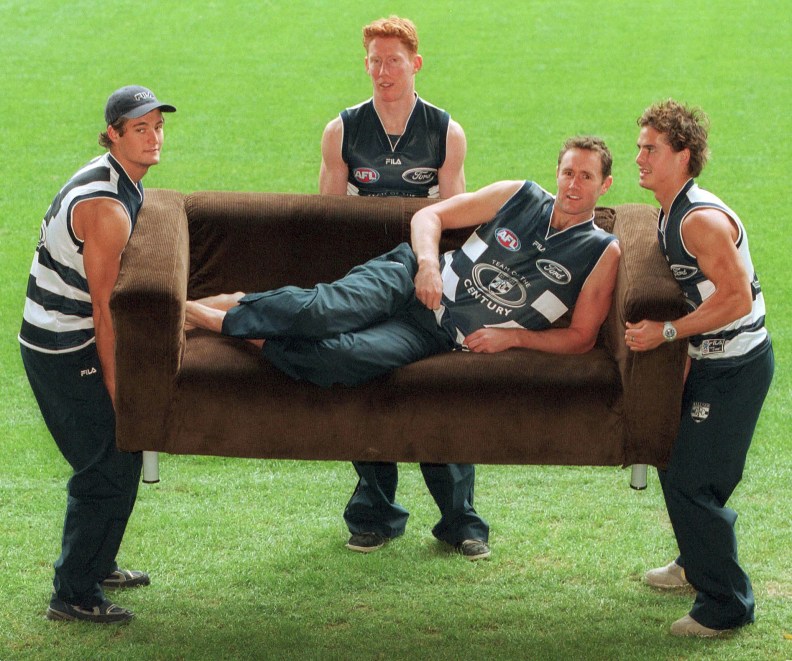 07/06/2001. .James Rahilly, left, Cameron Ling and Davis Spriggs give their captain Ben Graham (on couch) a boost. Geelong Football Team. Team of the Century nominations.
