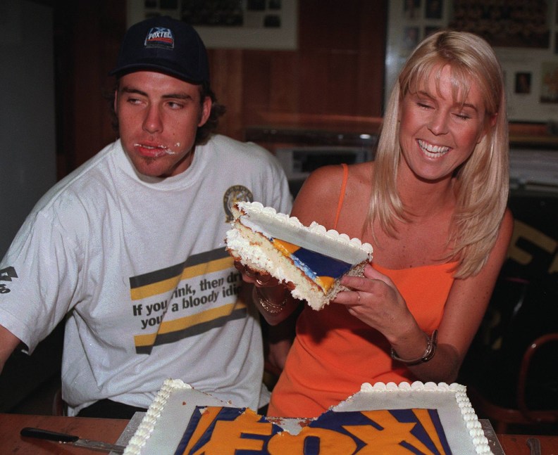 Mar97. Fox Sport celebrates its first birthday. Richmond Football club. Richmonds Matthew Richardson and Fox sport reporter Fiona Darmody celebrate with some cake. p/
/football